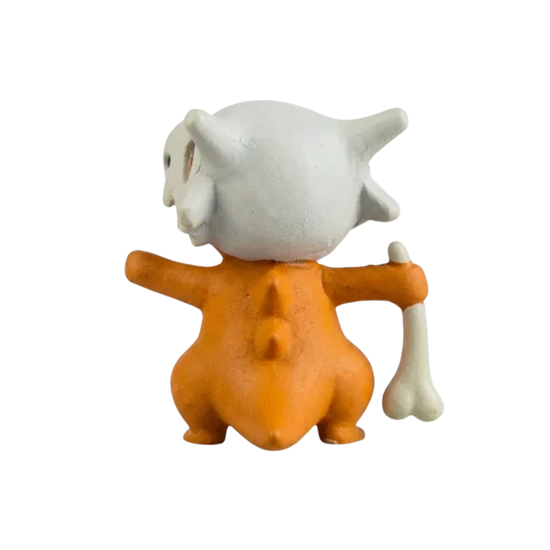 Figurine Osselait avec ses petites pattes et son apparence de jeune Pokémon mystérieux.