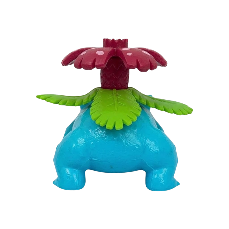 Figurine Florizarre Pokémon avec ses grandes feuilles vertes et sa fleur tropicale caractéristique.
