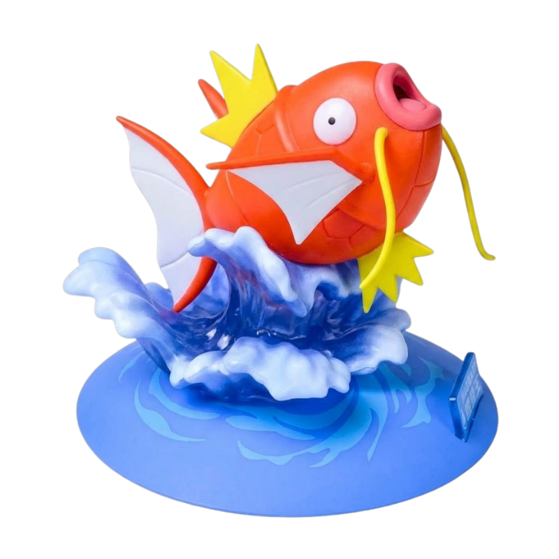 Figurine Magicarpe Pokémon avec son corps orange et ses nageoires jaunes caractéristiques.