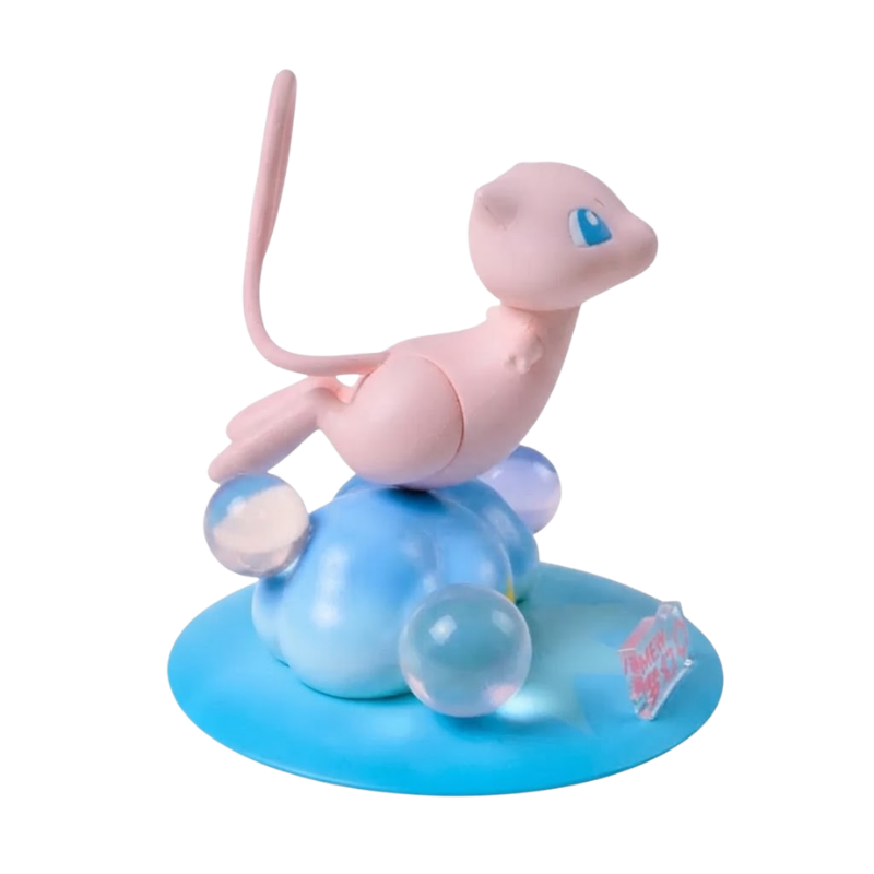 Figurine Mew Pokémon avec ses grands yeux bleus et son corps rose caractéristique.