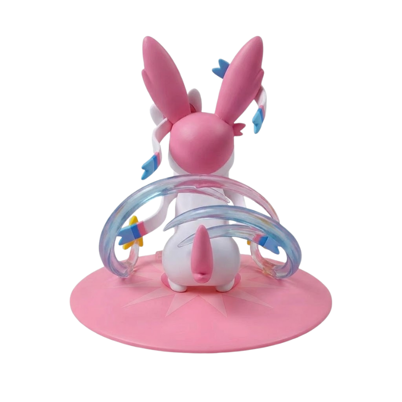 Figurine Nymphali Pokémon avec ses grandes oreilles et ses nœuds roses et bleus caractéristiques.