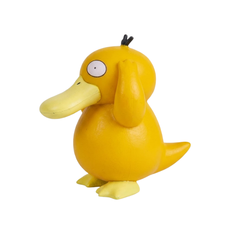 Figurine Psykokwak Pokémon avec ses grands yeux ronds et ses trois mèches noires sur la tête.